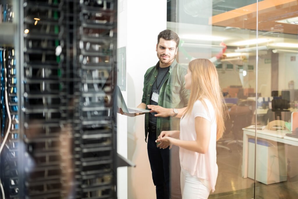 People discussing in a data center.